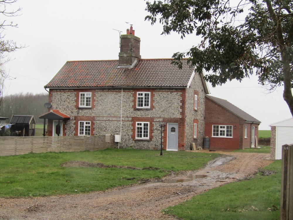 Brick home with white window frames